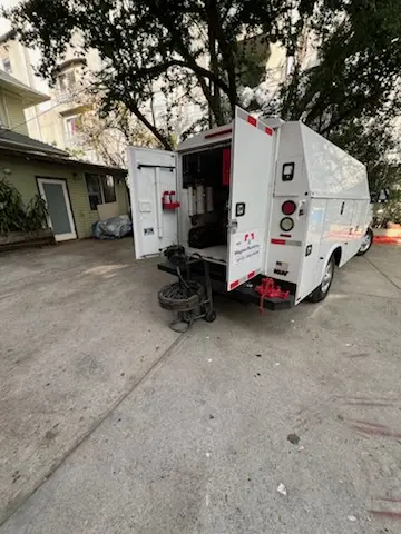 Magnet Plumbing service vehicle on-site for Sewer Line Repair in Austin